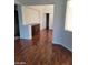 Living room featuring hardwood flooring, natural light, and open design at 10134 Reflection Brook Ave, Las Vegas, NV 89148