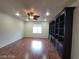 Large living room featuring hardwood floors and a built-in bookcase at 10134 Reflection Brook Ave, Las Vegas, NV 89148
