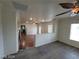 Open concept living room with hardwood floors, large entry, and a fireplace at 10134 Reflection Brook Ave, Las Vegas, NV 89148