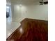 View of living room with hardwood floors, recessed lighting, and tiled entry at 10134 Reflection Brook Ave, Las Vegas, NV 89148