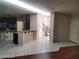 Open living room showcases tile floors, entry and staircase with natural light from the windows at 10134 Reflection Brook Ave, Las Vegas, NV 89148