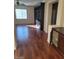 Open concept living area featuring built-in shelving and hardwood flooring at 10134 Reflection Brook Ave, Las Vegas, NV 89148