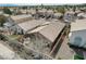 Detailed aerial shot of a home with a tiled roof and a cozy backyard patio at 10532 Beachwalk Pl, Las Vegas, NV 89144