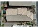 Overhead shot of a home showcasing its tile roof, landscaping, and outdoor patio area at 10532 Beachwalk Pl, Las Vegas, NV 89144