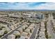 Sweeping aerial view showing a community near a hospital, with mountain views in the background at 10532 Beachwalk Pl, Las Vegas, NV 89144