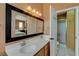 Bathroom featuring a double sink vanity with a view of the shower and toilet at 10532 Beachwalk Pl, Las Vegas, NV 89144