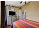 Cozy bedroom featuring neutral colored walls, a ceiling fan and modern decor at 10532 Beachwalk Pl, Las Vegas, NV 89144
