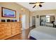 Bright bedroom with a large dresser and views to the bathroom and closet enhance the space at 10532 Beachwalk Pl, Las Vegas, NV 89144