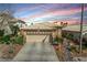 Lovely single-story home with a two-car garage, desert landscaping, and a welcoming facade at 10532 Beachwalk Pl, Las Vegas, NV 89144