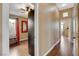 Hallway view shows the wood floor and natural light coming from the bedroom window at 10532 Beachwalk Pl, Las Vegas, NV 89144