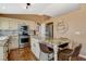 Modern kitchen with stainless steel appliances, granite countertops, and a functional center island at 10532 Beachwalk Pl, Las Vegas, NV 89144