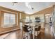 Bright kitchen featuring granite countertops, ample cabinet space, and a convenient island with seating at 10532 Beachwalk Pl, Las Vegas, NV 89144