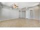 Open living room with neutral colors, tile flooring, and a decorative ceiling fan at 1101 Coral Desert Drive, Las Vegas, NV 89123