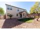 View of the home's backyard featuring low maintenance desert landscaping and covered patio space at 11273 Accademia Ct, Las Vegas, NV 89141