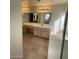 Bathroom featuring a tiled floor, vanity, and a walk in shower at 1213 Daytona Ln, Las Vegas, NV 89117