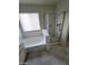 Bathroom featuring a bathtub, shower, tile floor, and a window at 1213 Daytona Ln, Las Vegas, NV 89117