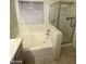 Bathroom featuring a bathtub, shower, and tile floor at 1213 Daytona Ln, Las Vegas, NV 89117