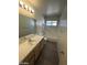 A clean bathroom featuring a bathtub-shower combo and a vanity at 1213 Daytona Ln, Las Vegas, NV 89117