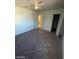 Bedroom with ceiling fan, access to another room, and a walk-in closet at 1213 Daytona Ln, Las Vegas, NV 89117