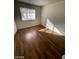Bedroom with hardwood flooring, providing ample sunlight and comfortable living space at 1213 Daytona Ln, Las Vegas, NV 89117