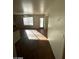 Sunlit dining room with wood floors and view to the backyard at 1213 Daytona Ln, Las Vegas, NV 89117