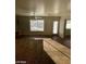 Dining area filled with natural light, features backyard access, and tiled floors at 1213 Daytona Ln, Las Vegas, NV 89117