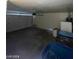 Spacious garage with ample storage space and a large garage door at 1213 Daytona Ln, Las Vegas, NV 89117