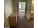 Hallway with a cabinet leading to another bedroom and the bathroom at 1213 Daytona Ln, Las Vegas, NV 89117