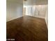 Hallway featuring wood-style tile flooring leading to stairs and other rooms at 1213 Daytona Ln, Las Vegas, NV 89117