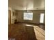 Bright kitchen area featuring a ceiling fan, built in desk area and a granite countertop island at 1213 Daytona Ln, Las Vegas, NV 89117