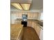 Updated kitchen featuring wood floors, granite countertops, and stainless steel appliances at 1213 Daytona Ln, Las Vegas, NV 89117