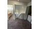 Upstairs landing with laundry closet and access to bathroom and bedrooms at 1213 Daytona Ln, Las Vegas, NV 89117