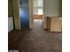 View of living room with neutral carpet and access to additional rooms at 1213 Daytona Ln, Las Vegas, NV 89117