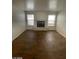 Spacious living room with wood-style tile flooring and a cozy fireplace at 1213 Daytona Ln, Las Vegas, NV 89117