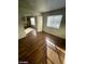 Spacious living room featuring stylish laminate floors and plenty of natural light at 1213 Daytona Ln, Las Vegas, NV 89117