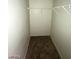 Narrow empty walk-in closet with one shelf at 1213 Daytona Ln, Las Vegas, NV 89117