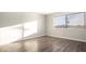 Bedroom featuring laminate flooring and a large window, providing scenic views and ample natural light at 1405 Vegas Valley Dr # 306, Las Vegas, NV 89169