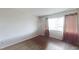Bedroom features include laminate flooring, and large windows draped with elegant curtains at 1405 Vegas Valley Dr # 306, Las Vegas, NV 89169