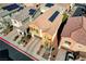 A beautiful view of a well-maintained, two-story home featuring a terracotta roof and solar panels at 1908 Morro Vista Dr, Las Vegas, NV 89135