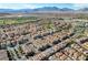 Sweeping aerial view of a neighborhood and community amenities, with mountains visible in the distance at 1908 Morro Vista Dr, Las Vegas, NV 89135