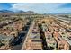 Wide aerial shot of a residential area with mountains in the background at 1908 Morro Vista Dr, Las Vegas, NV 89135