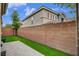 Private backyard with low-maintenance artificial turf and block wall at 1908 Morro Vista Dr, Las Vegas, NV 89135