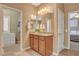 Bathroom featuring a vanity, walk-in closet, and access to a bedroom at 1908 Morro Vista Dr, Las Vegas, NV 89135
