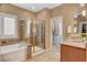 Bright bathroom with a separate shower and tub as well as a walk-in closet at 1908 Morro Vista Dr, Las Vegas, NV 89135