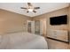 A spacious bedroom featuring a ceiling fan, a dresser and a closet at 1908 Morro Vista Dr, Las Vegas, NV 89135