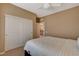 Bedroom features neutral walls, carpet, ceiling fan, and a large closet at 1908 Morro Vista Dr, Las Vegas, NV 89135