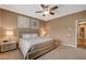 Spacious bedroom featuring neutral decor, wall art, and an entrance to a hallway at 1908 Morro Vista Dr, Las Vegas, NV 89135