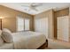 Comfortable bedroom with neutral walls, carpet, ceiling fan, and bright shutters at 1908 Morro Vista Dr, Las Vegas, NV 89135