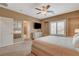 Comfortable bedroom with carpeted floors, a ceiling fan and natural light from the window at 1908 Morro Vista Dr, Las Vegas, NV 89135