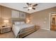 Relaxing bedroom featuring carpeted floors, ceiling fan, and stylish decor for optimal comfort and rest at 1908 Morro Vista Dr, Las Vegas, NV 89135